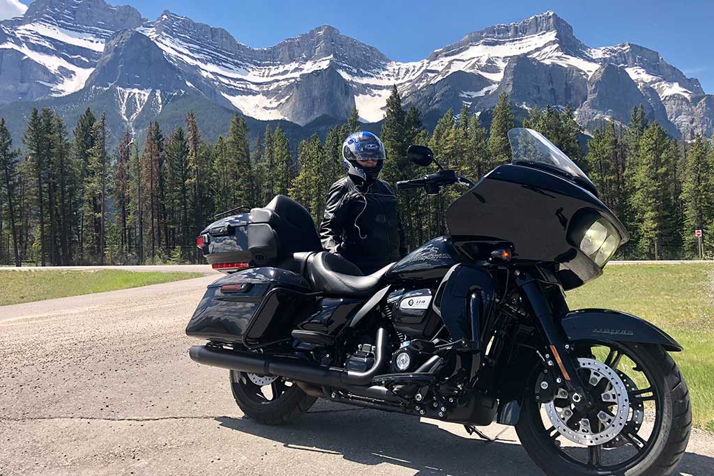 biker on the middle of the road parked