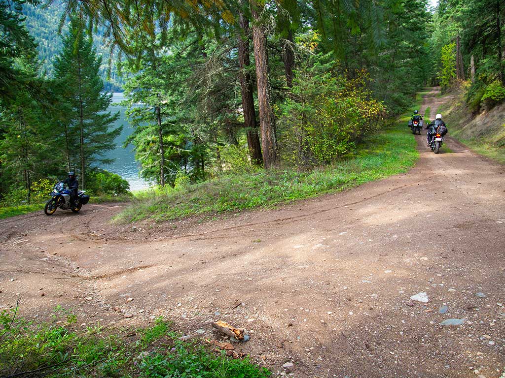 bikers on a trail going up the hills